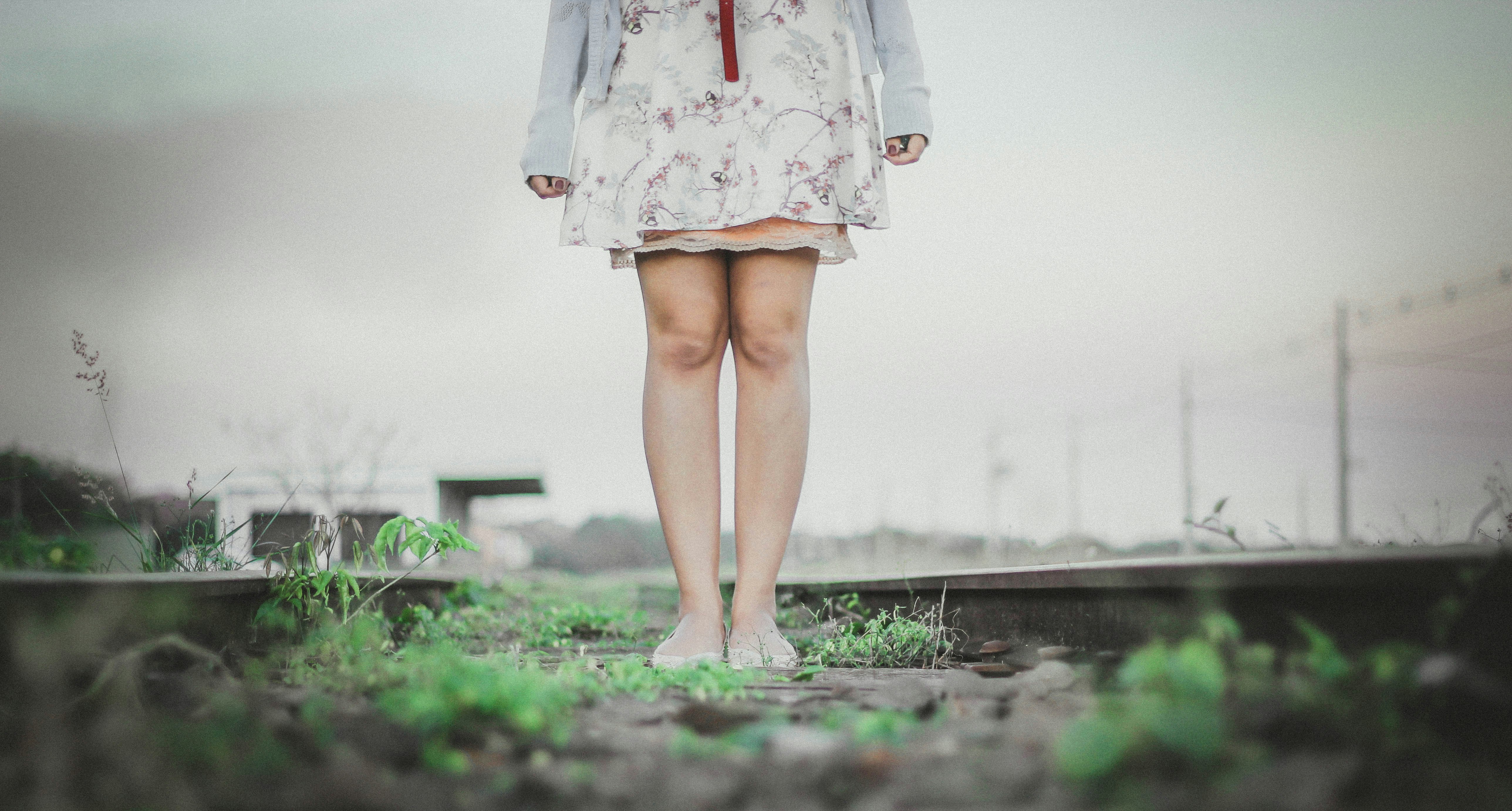 person standing wearing white dress